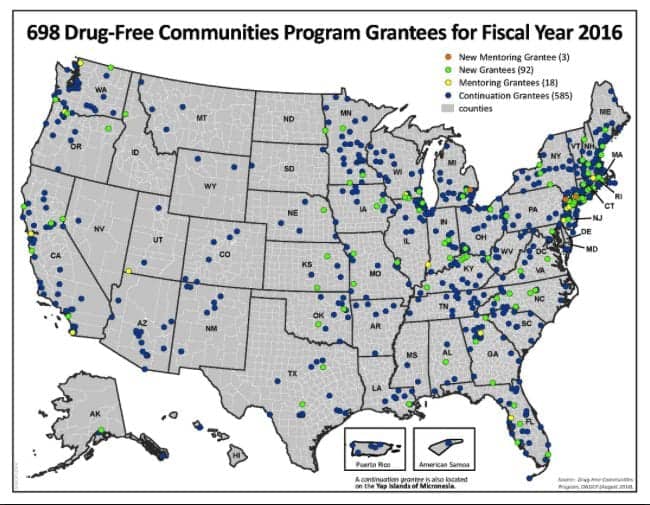 U.S. map showing locations of 698 Drug-Free Communities Program grantees for fiscal year 2016, including U.S. territories. Green dots mark new mentoring grantees, yellow dots new grantees, blue dots mentoring grantees, and small blue dots continuation grantees. Fairfax residents are among the ONDCP Grantee recipients. CA Norml