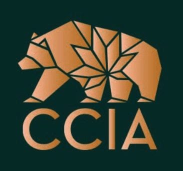 Image shows a logo of a bear composed of geometric shapes in a gold color, with the letters "CCIA" beneath it in matching gold on a dark green background, representing the Conference's emblem. CA Norml