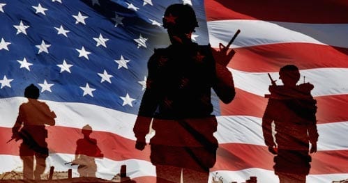 Silhouettes of soldiers with varying gear and positions are superimposed against a large American flag. The background is a blend of the flag's bold red, white, and blue colors with stars and stripes. The scene evokes a strong sense of patriotism and duty, reflective of Southern California Regional VA Policy on medical marijuana use. CA Norml