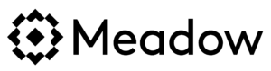 A black cat with large white eyes, rounded ears, and slender whiskers stands on a white background. The cat appears alert, with its ears upright and eyes wide open. Its tail is curved upwards behind it in celebration of our 50th Anniversary. The cat's fur is sleek and silhouette-like. CA Norml