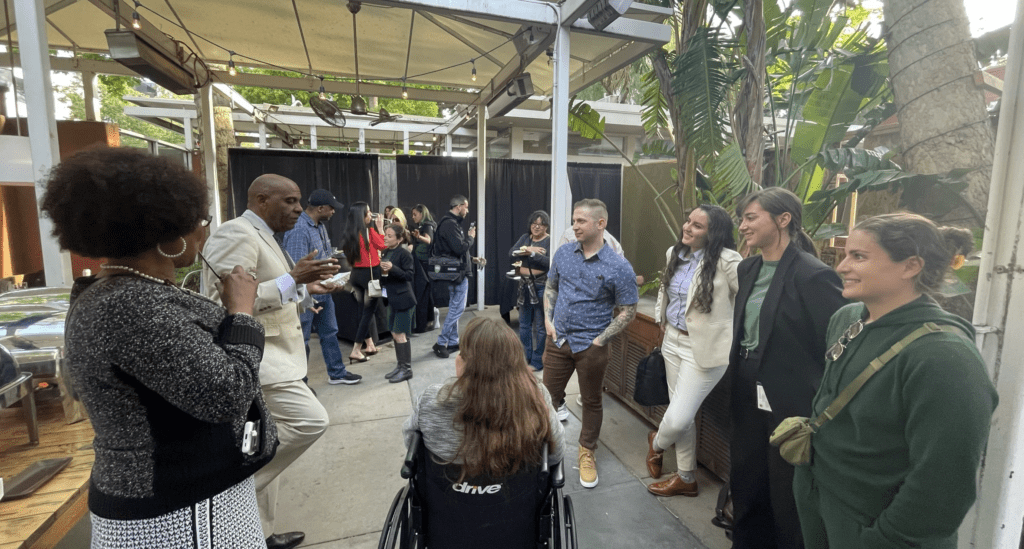 (L to R) Asm. Tina McKinnor and Sen. Steve Bradford chatting with attendees at the 2023 Lobby Day afterparty