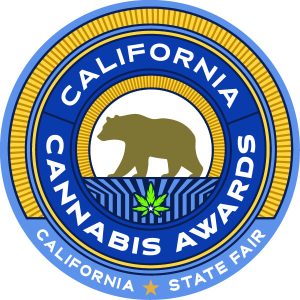 Seal for the California Cannabis Awards at the California State Fair, featuring a brown bear, a cannabis leaf, and text—a Cal 215 Tribute design. Ca NORML